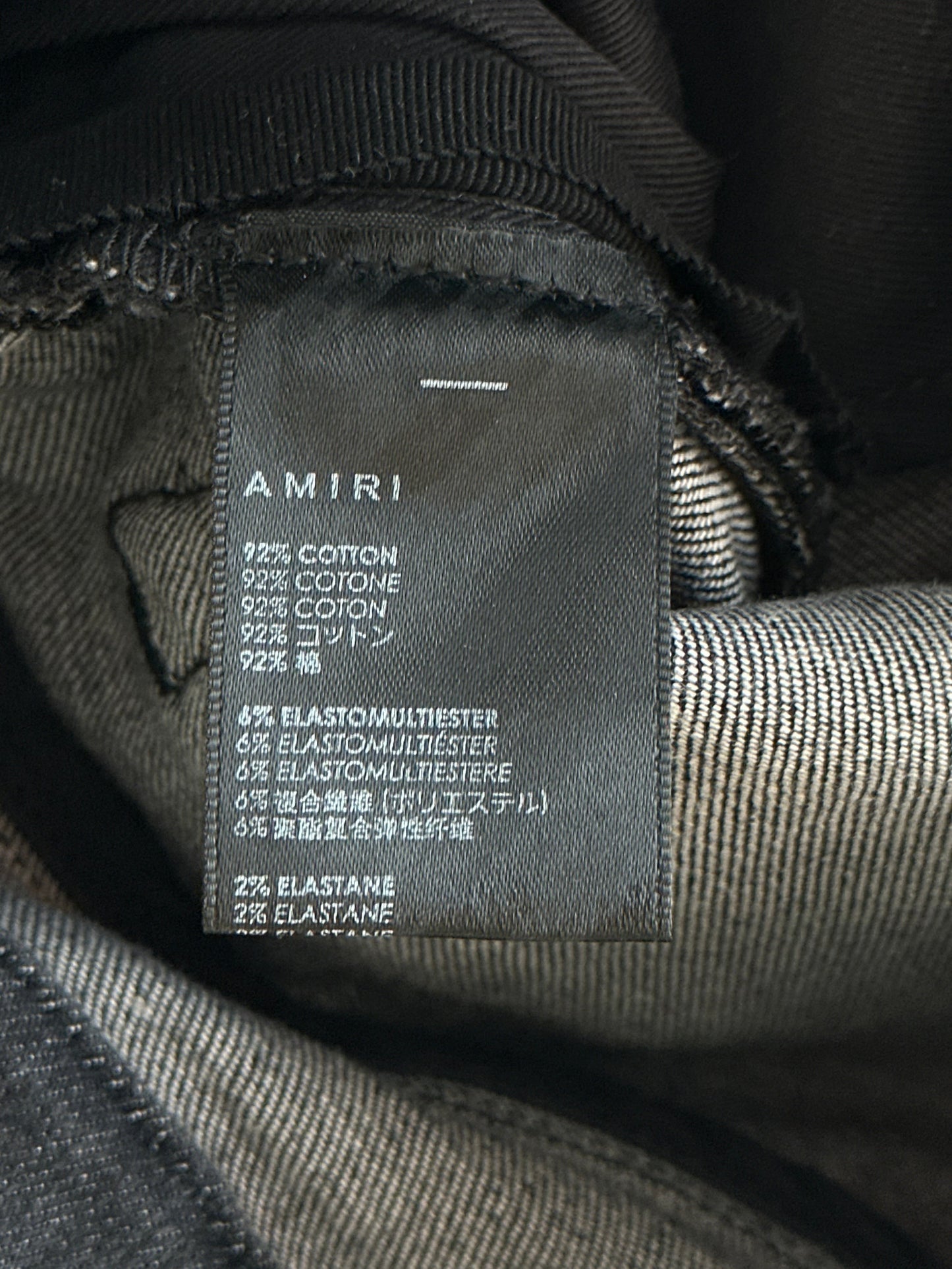 Amiri Storm Grey Staggered Logo Jeans