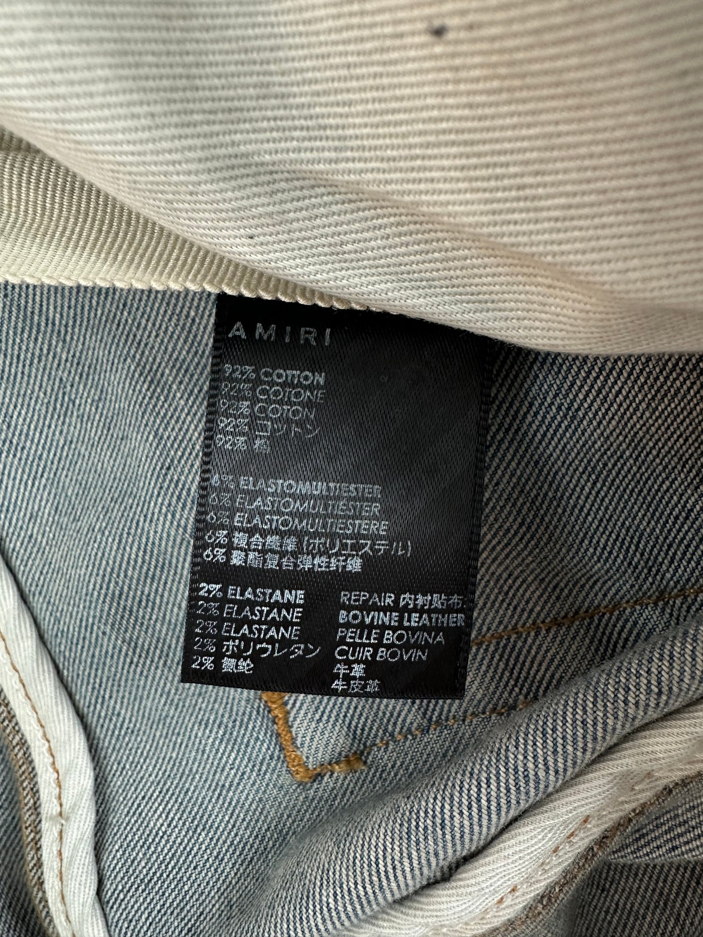 Amiri Clay Indigo Distressed Logo Jeans