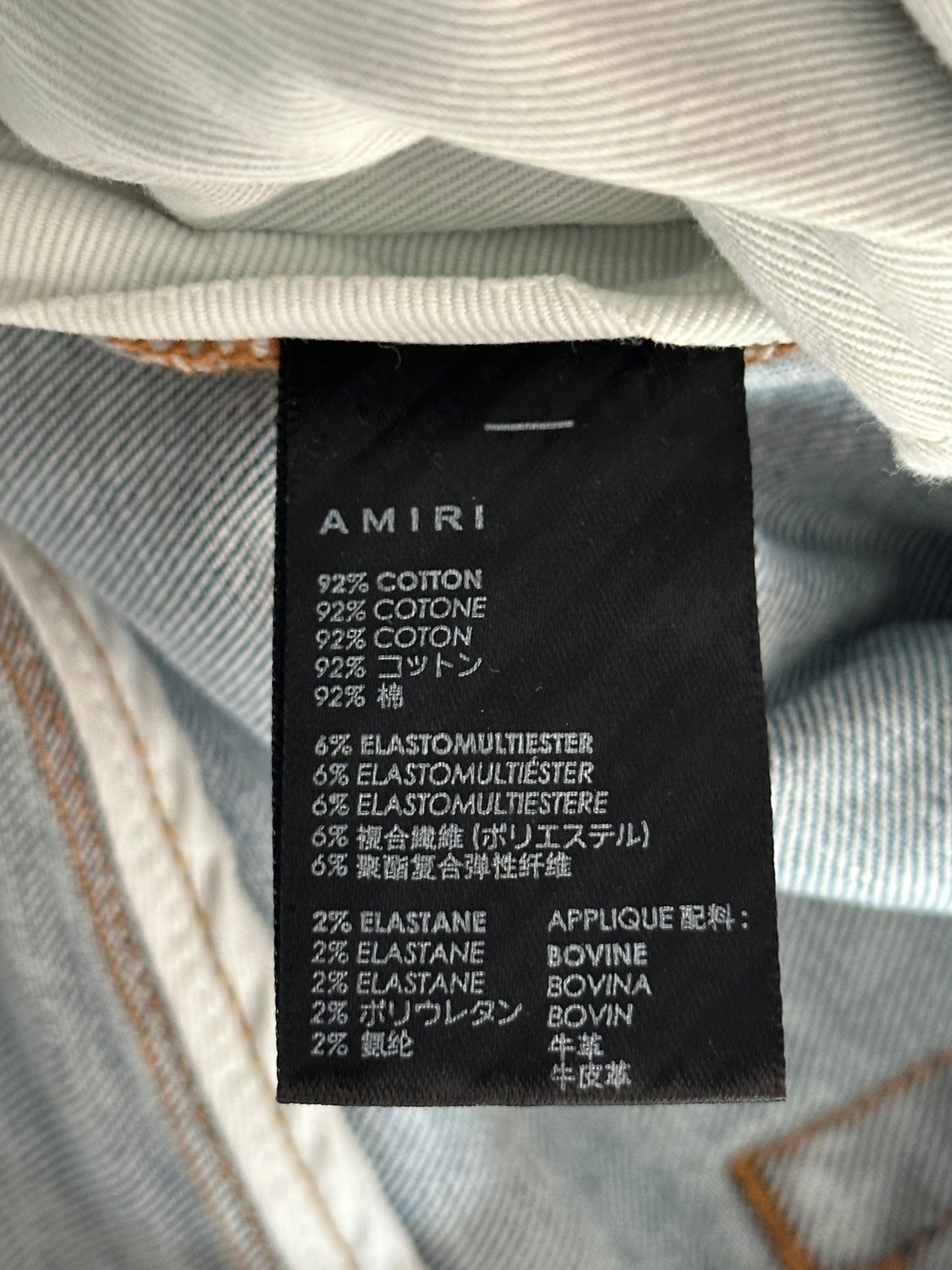 Amiri Stone Indigo Black Leather Patch Thrasher Jeans