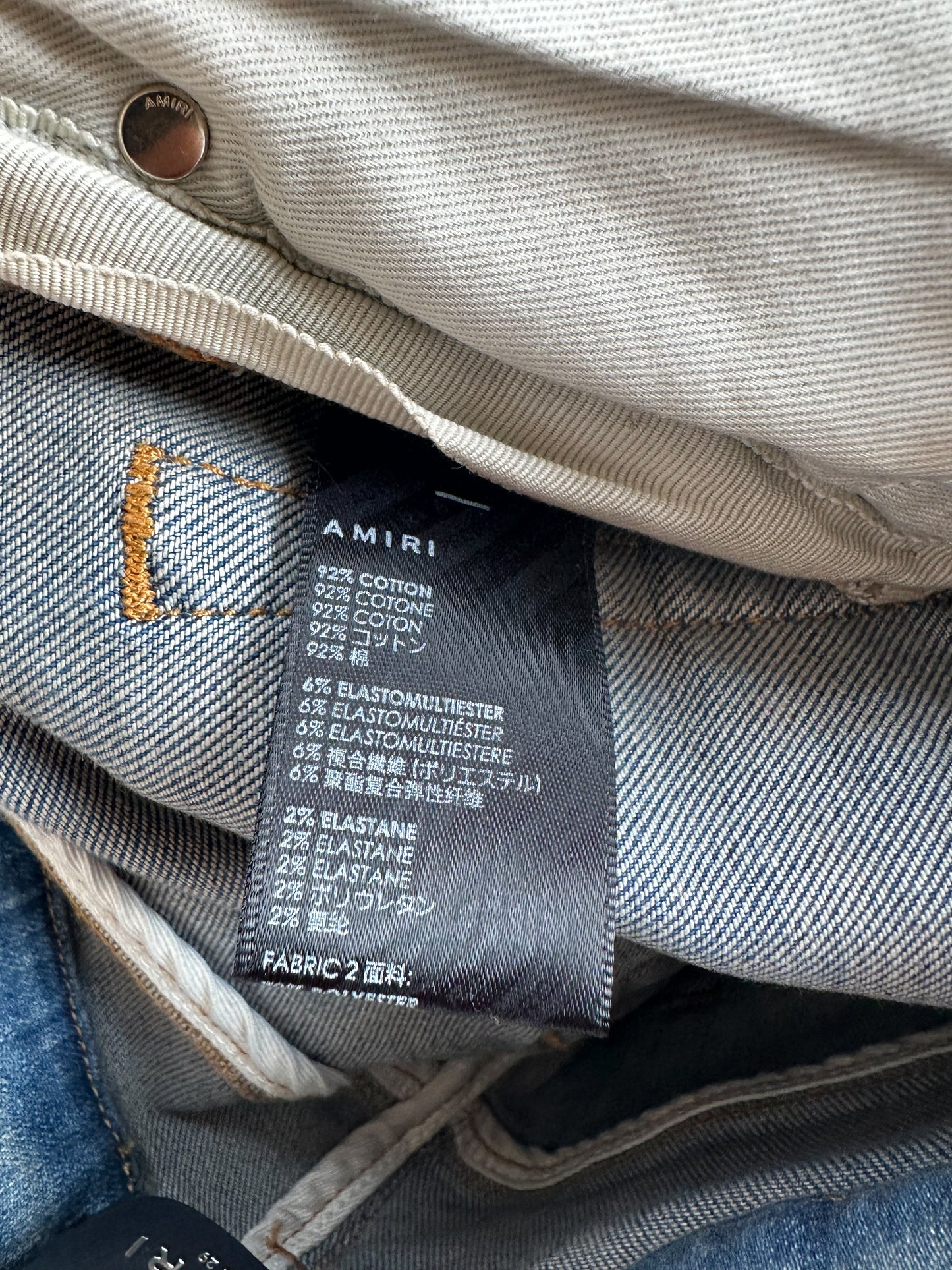 Amiri Clay Indigo Serif Logo Distressed Jeans