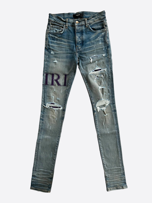 Amiri Clay Indigo Serif Logo Distressed Jeans