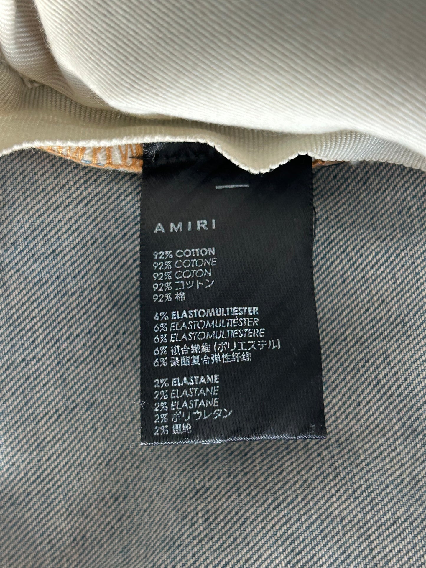 Amiri Clay Indigo Broken Distressed Jeans