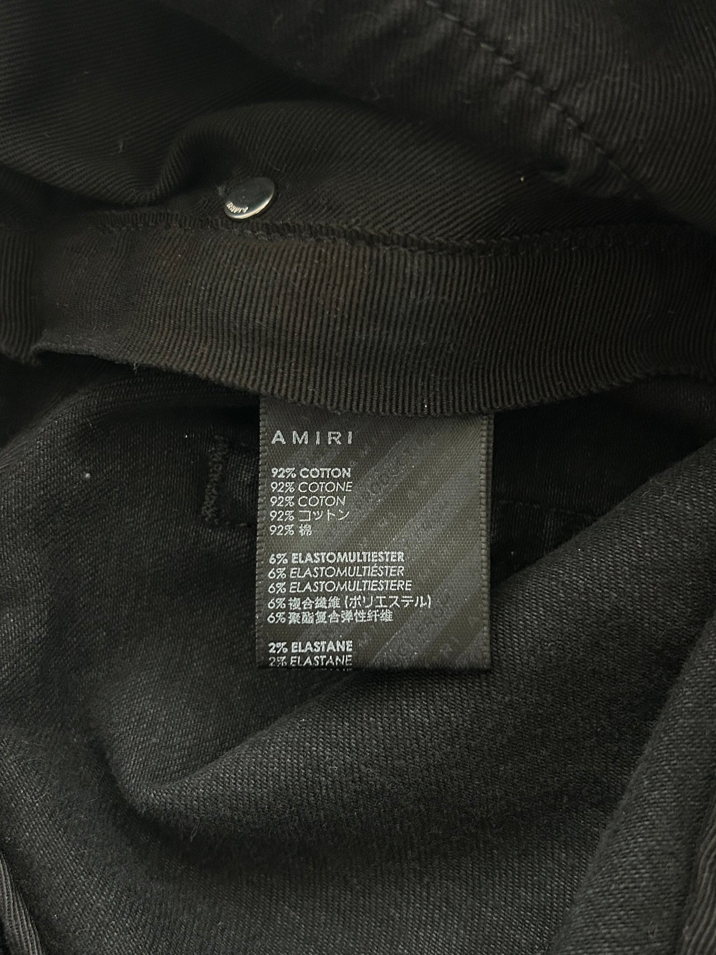 Amiri Faded Black Patch Thrasher Jeans