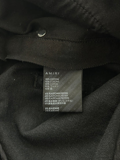 Amiri Faded Black Patch Thrasher Jeans