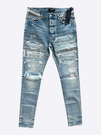 Amiri Clay Indigo Distressed Repair Logo Thrasher Jeans