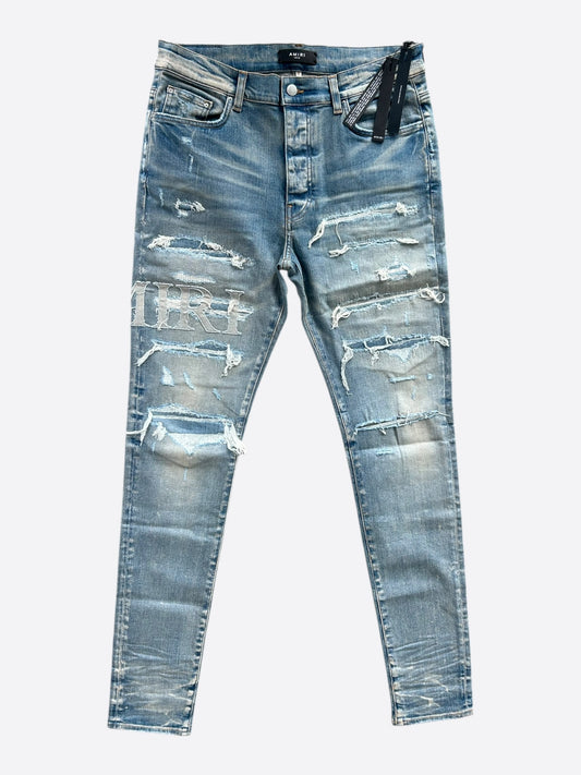 Amiri Clay Indigo Distressed Repair Logo Thrasher Jeans