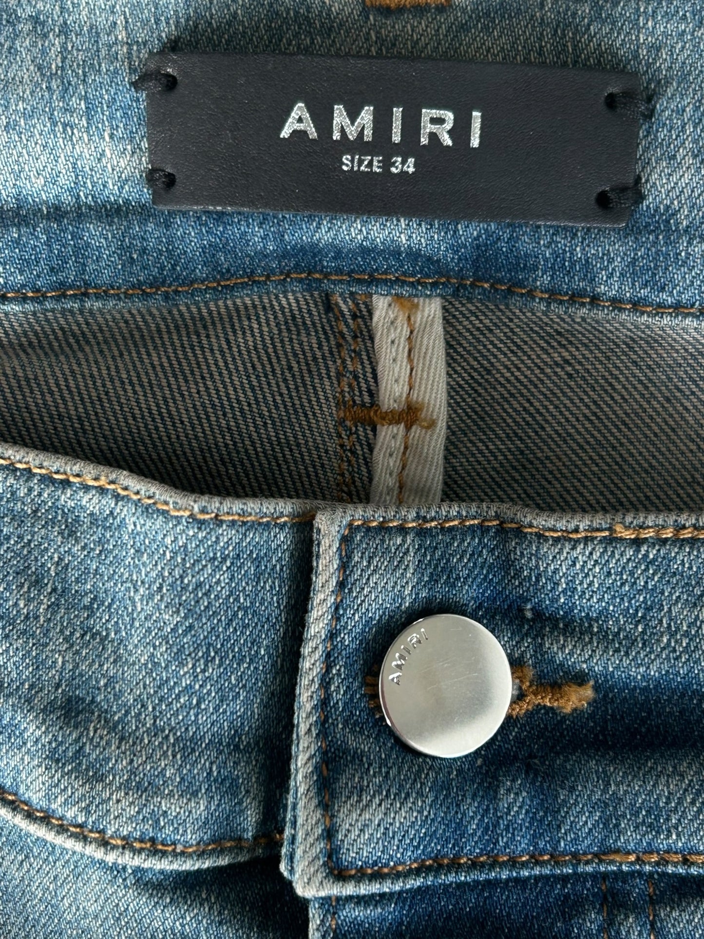Amiri Clay Indigo Distressed Repair Logo Thrasher Jeans