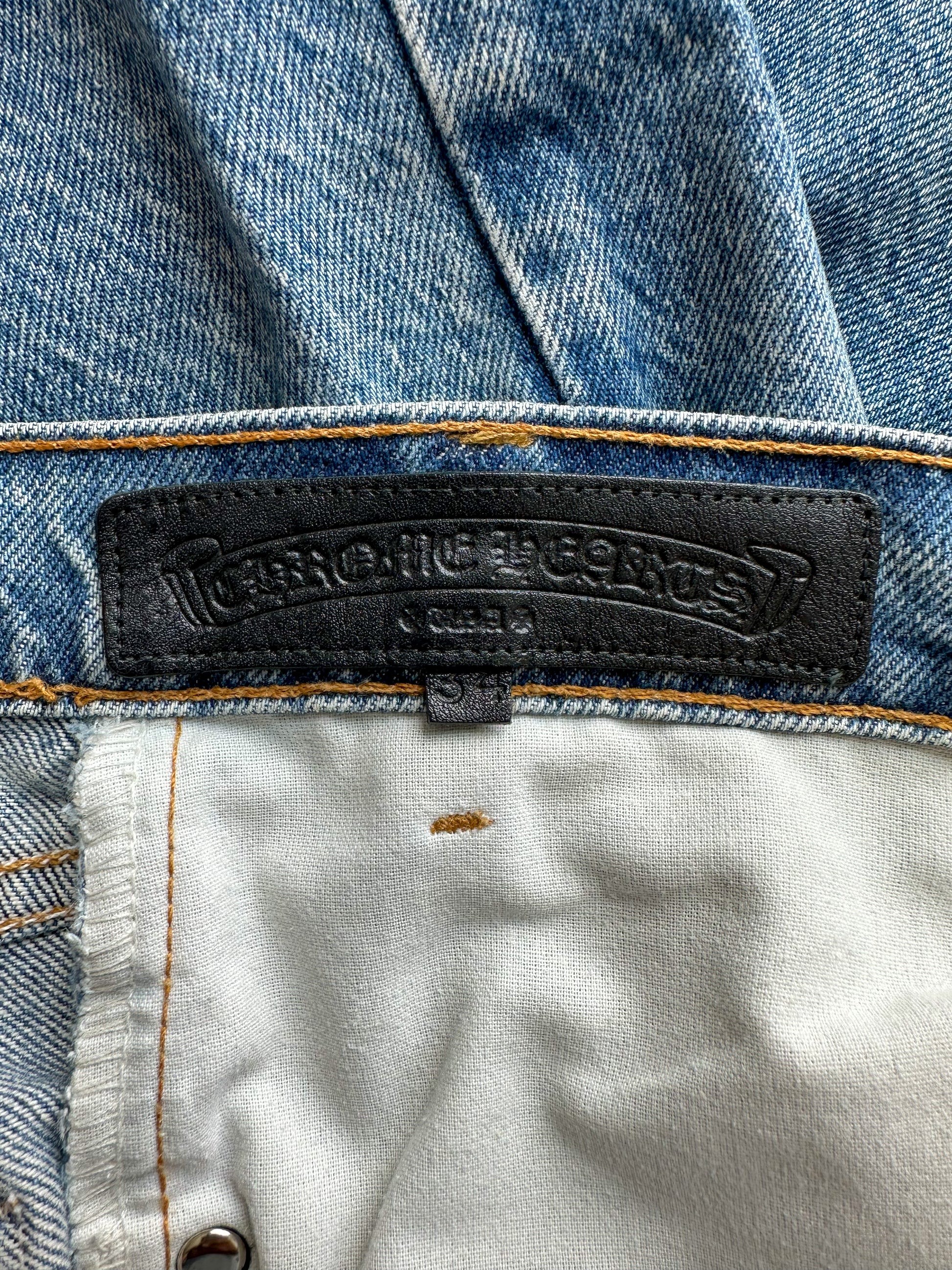 CHROME HEARTS LIGHT BLUE DENIM JEANS IN BLACK LEATHER CROSS PATCH