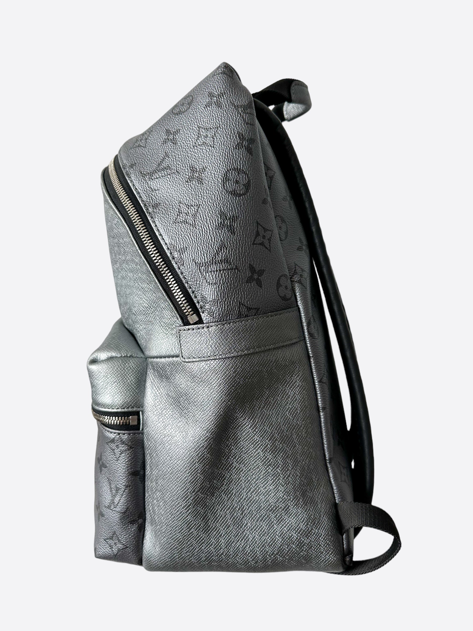 LOUIS VUITTON Monogram Embossed Discovery Backpack silver buckle