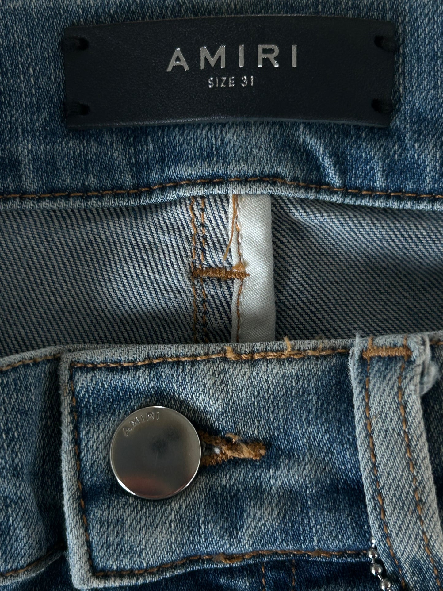 Amiri Clay Indigo White Patch Thrasher Jeans