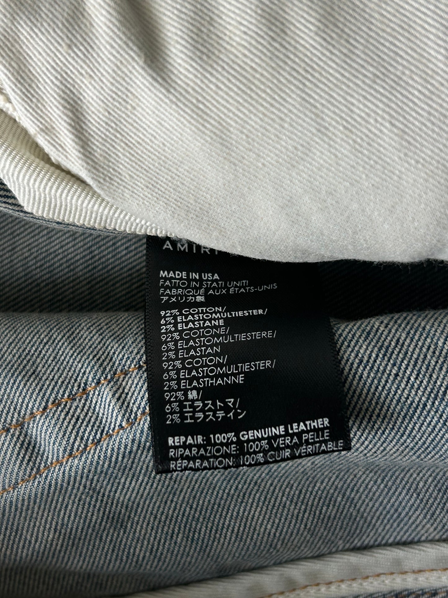 Amiri Clay Indigo & Black English Logo Distressed Jeans