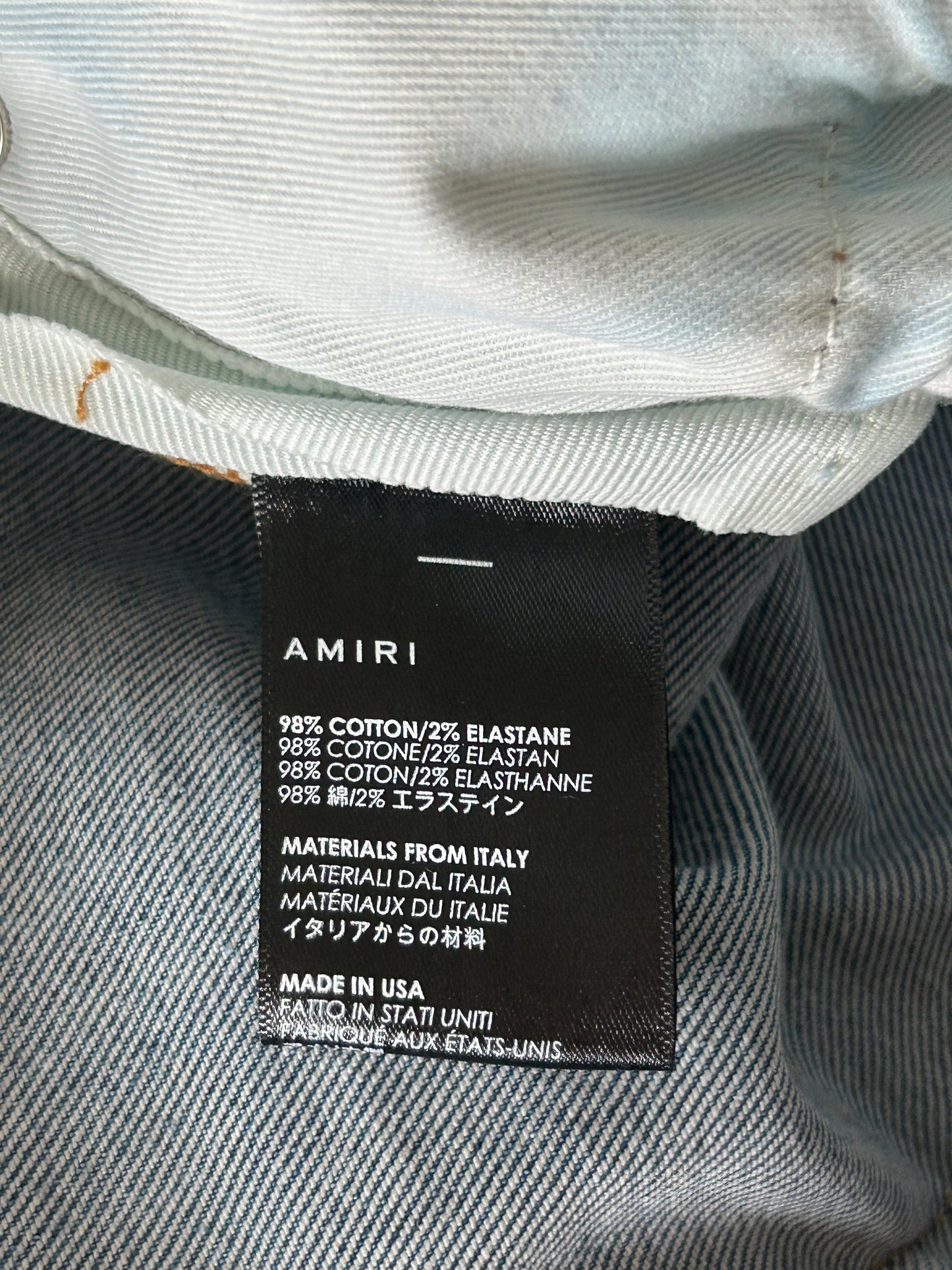 Amiri Clay Indigo Watercolor Patch Thrasher Jeans