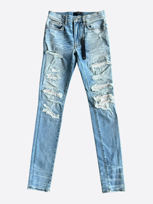 Amiri Clay Indigo White Patch Thrasher Jeans