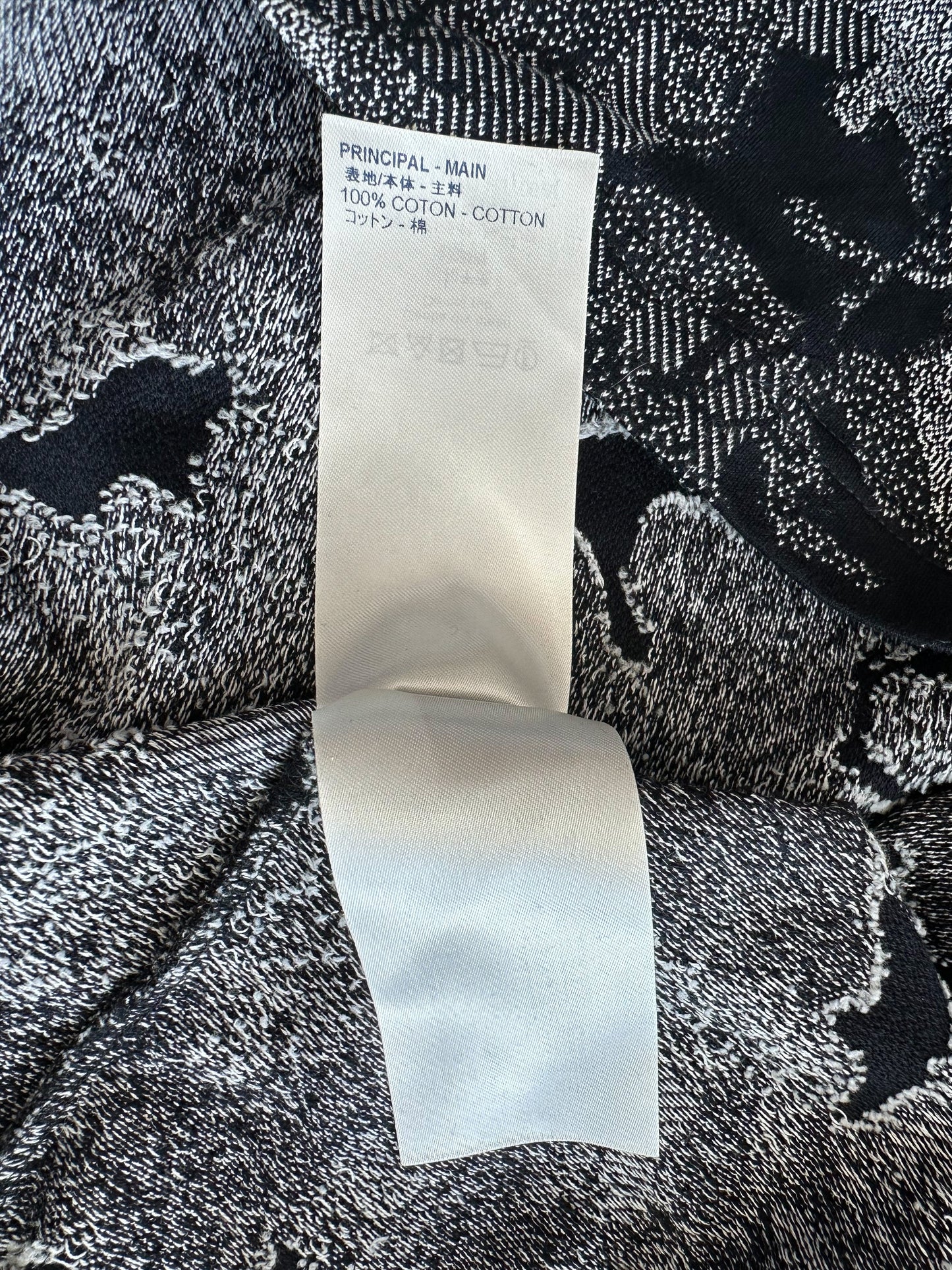 Black Louis Vuitton monogram print on white cotton fabric