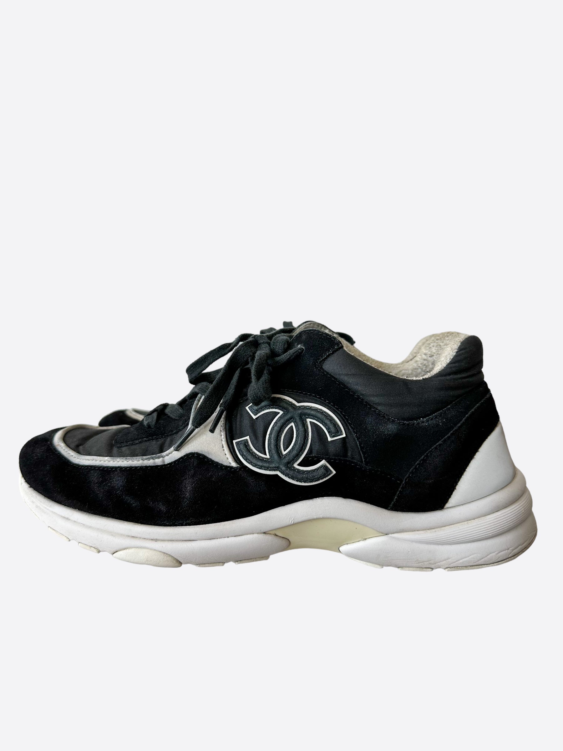 Chanel black sale and white trainers