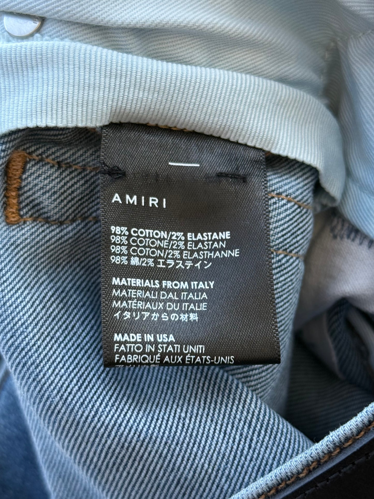 Amiri Clay Indigo Multicolor Patch Distressed Jeans