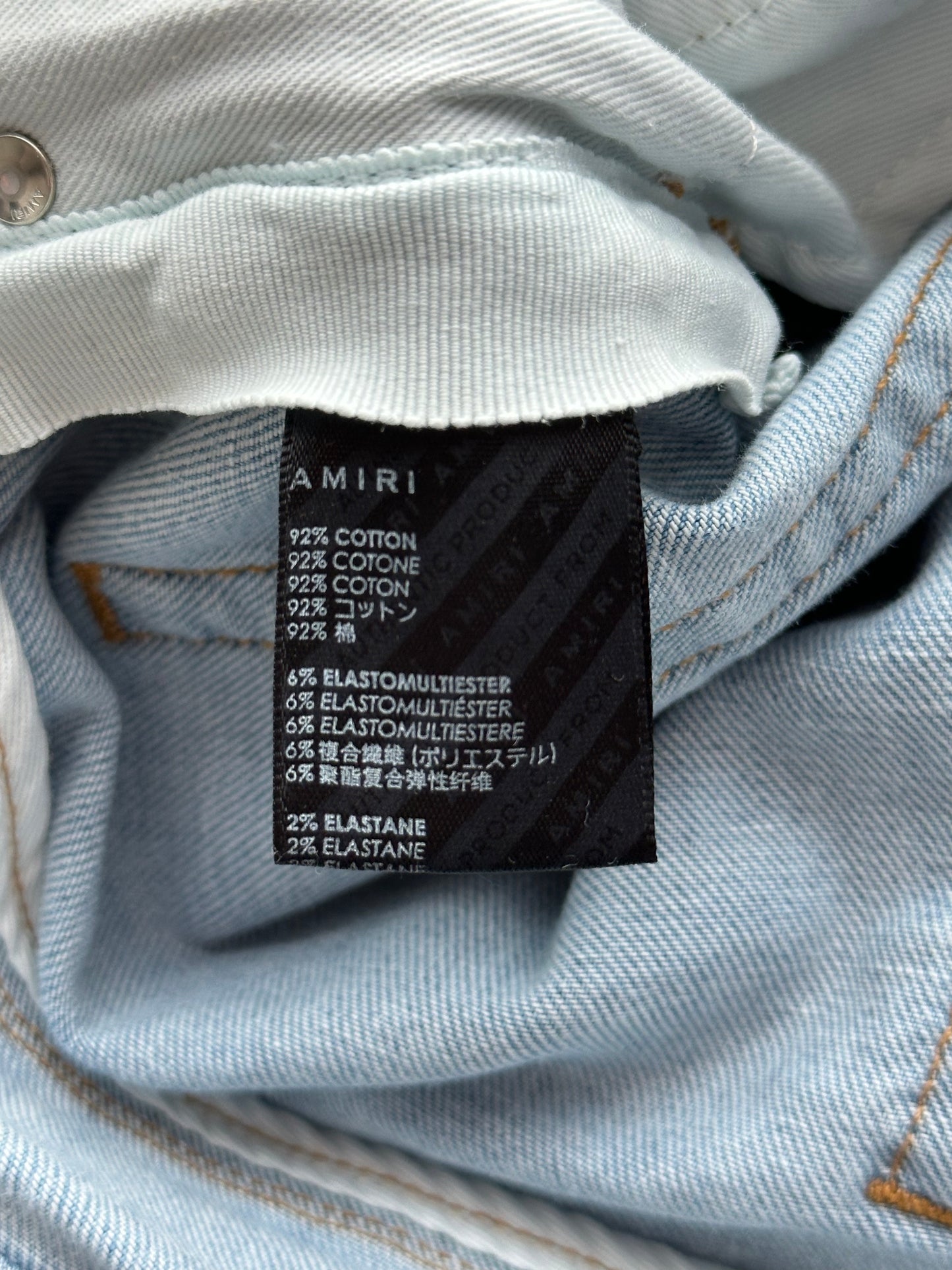 Amiri Light Indigo Orange Patch Thrasher Jeans