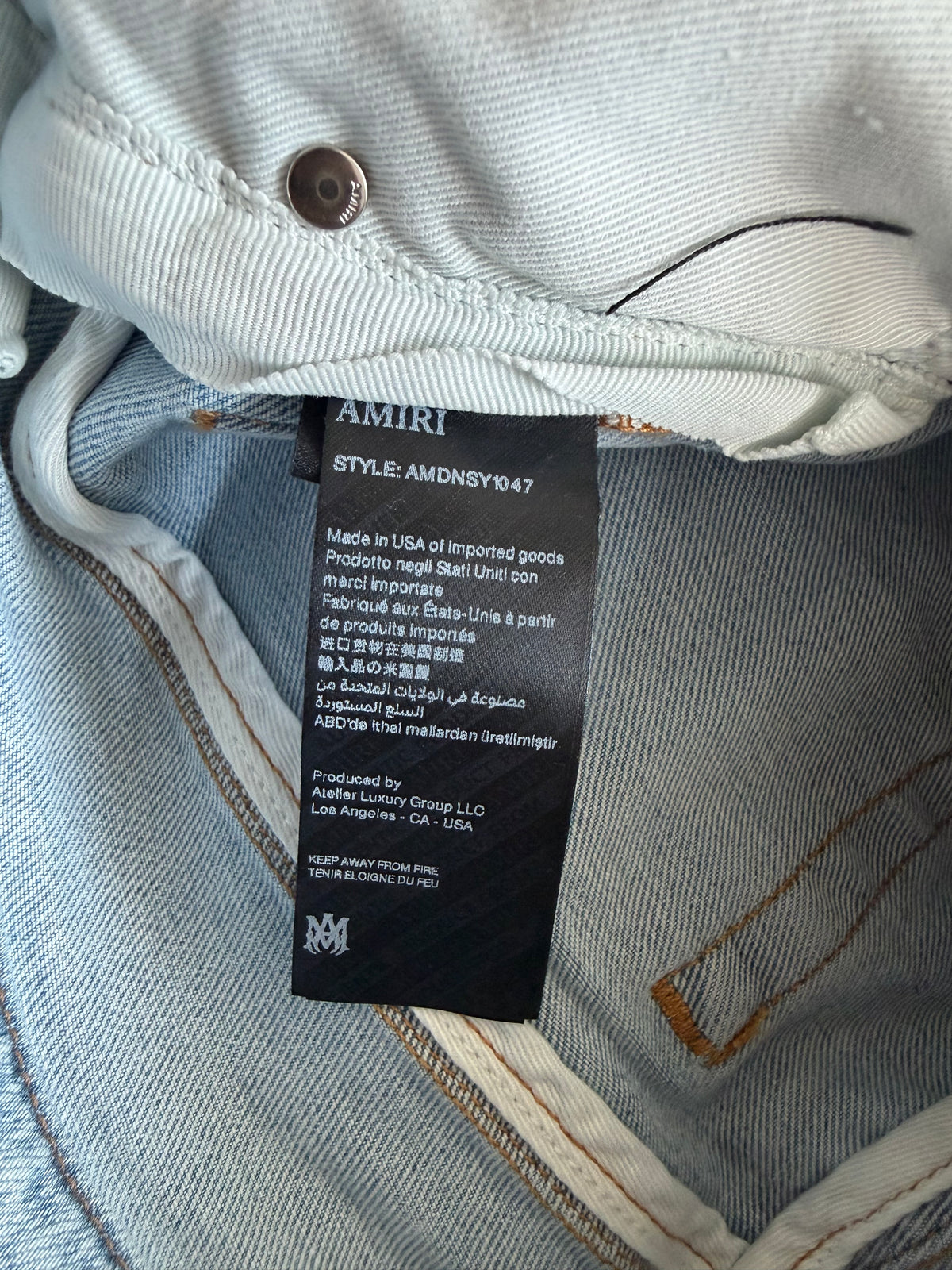 Amiri Clay Indigo Distressed MA Varsity Repair Jeans