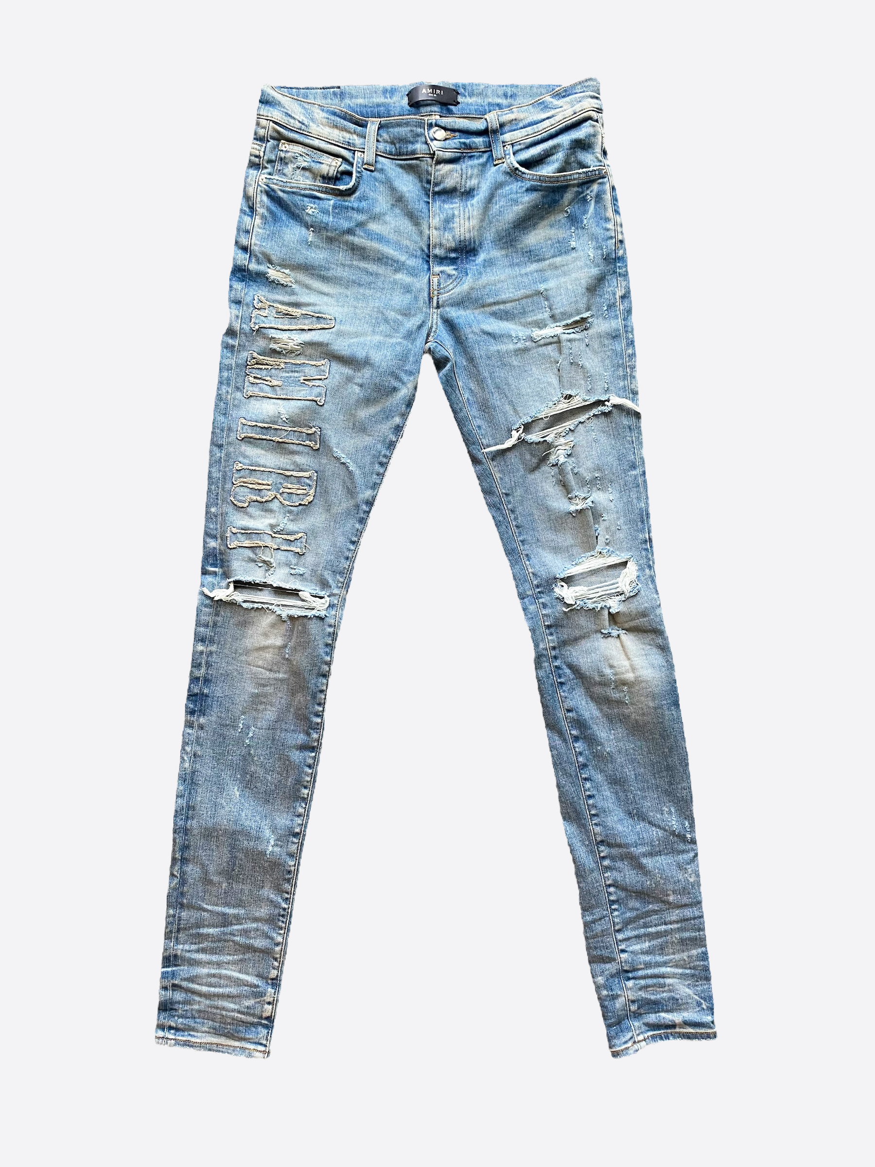 Amiri blue sale ripped jeans