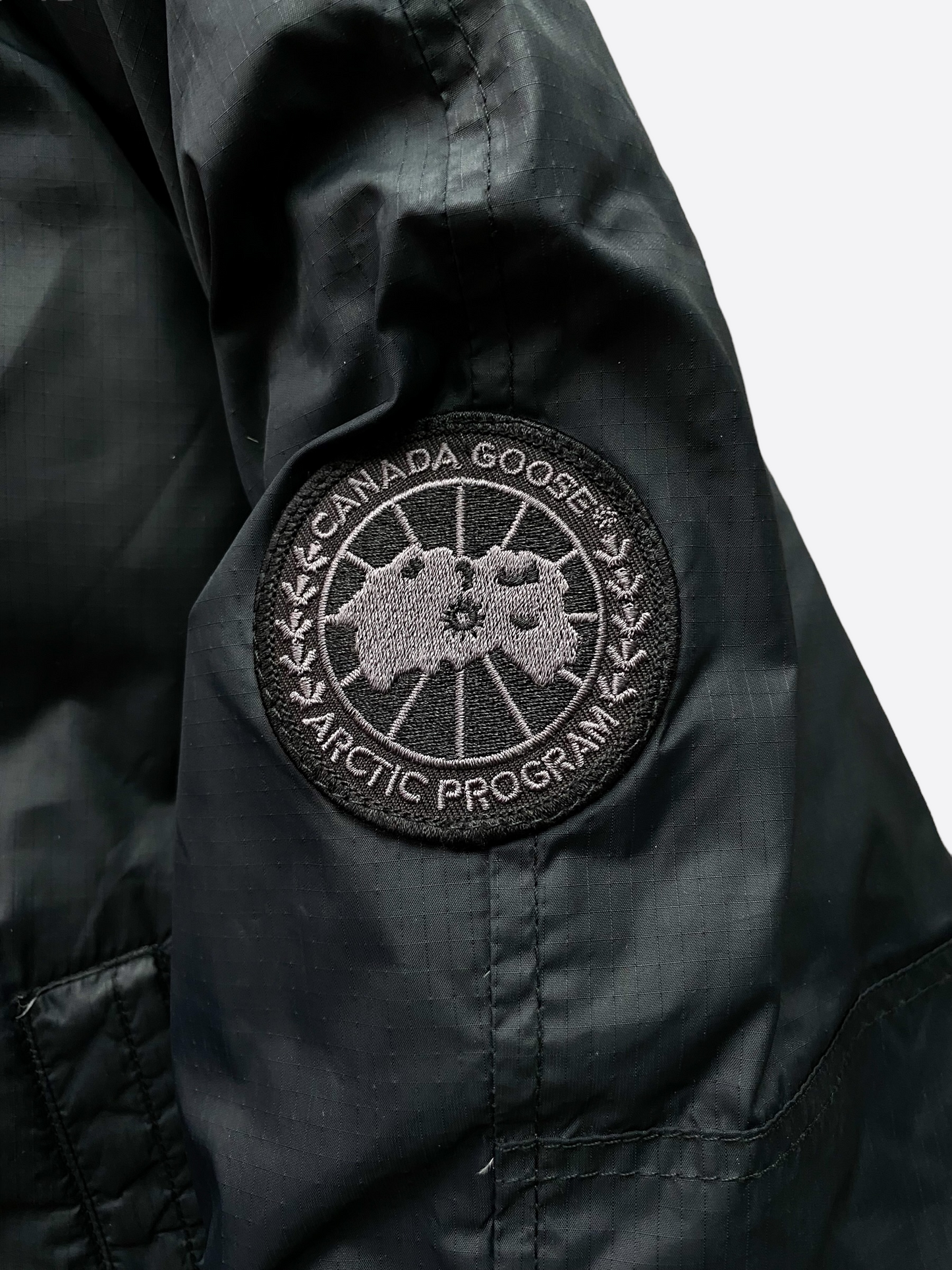 Canada goose black hotsell label fake vs real